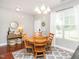 Inviting dining room features a wood table, chairs, decor, and bright natural light at 2605 Mcdougall Dr, Burlington, NC 27217