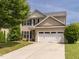 Charming two-story home featuring a two-car garage, well-maintained lawn, and classic design elements at 2605 Mcdougall Dr, Burlington, NC 27217