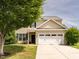 Charming two-story home featuring a two-car garage, well-maintained lawn, and classic design elements at 2605 Mcdougall Dr, Burlington, NC 27217