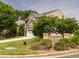 Beautiful two-story home with a well-manicured lawn and mature trees at 2605 Mcdougall Dr, Burlington, NC 27217