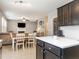 Open living and dining area featuring hardwood floors, a fireplace, and comfortable seating at 2605 Mcdougall Dr, Burlington, NC 27217