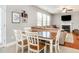 Inviting living and dining area with hardwood floors and a fireplace with modern décor at 2605 Mcdougall Dr, Burlington, NC 27217