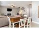 Open-concept living space with dining area and a cozy fireplace, perfect for Gathering gatherings at 2605 Mcdougall Dr, Burlington, NC 27217