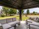 Relaxing outdoor seating area with a covered pavilion and a view of the well-maintained lawn at 2605 Mcdougall Dr, Burlington, NC 27217