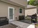 Back patio area with a door to the house and a grill at 2605 Mcdougall Dr, Burlington, NC 27217
