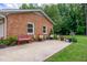 Welcoming back patio with a seating area, and great gardening and decor at 2824 Blanche Dr, Burlington, NC 27215