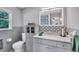 Modern bathroom features updated fixtures, a decorative backsplash, and cabinet space at 2824 Blanche Dr, Burlington, NC 27215