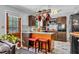 Stylish kitchen with stainless appliances, wooden cabinetry, and kitchen island with seating at 2824 Blanche Dr, Burlington, NC 27215