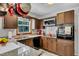 Modern kitchen featuring granite countertops, stainless steel appliances, and tile backsplash at 2824 Blanche Dr, Burlington, NC 27215