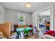 Cozy playroom with natural light, durable flooring, and an open doorway to another playroom at 2824 Blanche Dr, Burlington, NC 27215