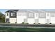 Modern townhome exterior showcasing a sleek design and well-manicured landscaping at 3004 Vitner Dr, Durham, NC 27704