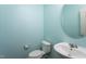 This aqua powder room features a modern sink and toilet at 310 Seymour Pl, Cary, NC 27519
