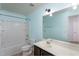 This aqua full bath features a large mirror and shower/tub combo at 310 Seymour Pl, Cary, NC 27519