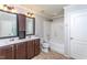 Bathroom featuring double sinks, combination tub and shower, and private toilet at 310 Seymour Pl, Cary, NC 27519