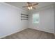 Neutral bedroom featuring a ceiling fan and built in shelves at 310 Seymour Pl, Cary, NC 27519