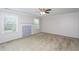 Bedroom with neutral carpet, a fireplace and natural light from two windows at 310 Seymour Pl, Cary, NC 27519