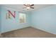 Bedroom featuring blue paint, a ceiling fan, and natural light from a window at 310 Seymour Pl, Cary, NC 27519