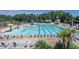 Large community pool with lounge chairs, umbrellas, and a slide is a refreshing amenity for residents at 310 Seymour Pl, Cary, NC 27519