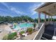Community pool area with a slide, splash pad, and lounge seating offers a fun and relaxing atmosphere at 310 Seymour Pl, Cary, NC 27519