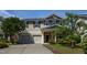 Charming two-story home featuring a two car garage and manicured landscaping at 310 Seymour Pl, Cary, NC 27519