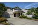 Charming townhome with a two-car garage, a covered front porch, and neatly landscaped front yard at 310 Seymour Pl, Cary, NC 27519