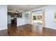 Kitchen and dining area with dark cabinetry, sliding glass doors and view of back yard at 310 Seymour Pl, Cary, NC 27519