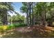 Picturesque pond view with a wooden bridge, framed by trees and natural foliage, offering a serene escape at 310 Seymour Pl, Cary, NC 27519
