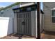 Durable outdoor storage shed featuring double doors, providing ample space for tools and equipment at 310 Seymour Pl, Cary, NC 27519