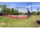 Outdoor tennis court with a black chain link fence is perfect for tennis enthusiasts at 310 Seymour Pl, Cary, NC 27519