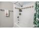 Bright bathroom with subway tile surround and tub/shower combination at 312 Green St, Sanford, NC 27330