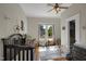 Sunny Bedroom with hardwood floors, crib, and a view of the outdoors through the windows at 312 Green St, Sanford, NC 27330
