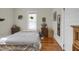 Bedroom with wood floors, a window and assorted decor items at 312 Green St, Sanford, NC 27330
