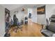 Bright bedroom with light hardwood flooring and niche for guitars and gaming at 312 Green St, Sanford, NC 27330