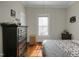 Bedroom featuring wood floors, soft natural lighting, and decor at 312 Green St, Sanford, NC 27330
