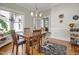 Charming dining room featuring wood floors, a wooden table, and windows providing natural light at 312 Green St, Sanford, NC 27330