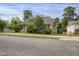 A view of the property highlighting the charming home, landscape, and neighboring buildings at 312 Green St, Sanford, NC 27330