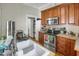 Kitchen area featuring wooden cabinets, stainless steel appliances, and a bright, inviting atmosphere at 312 Green St, Sanford, NC 27330
