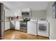 Kitchen with laundry area, stainless steel appliances, and a window at 312 Green St, Sanford, NC 27330