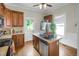 Cozy kitchen with tiled countertops, stainless steel appliances, and a kitchen island for food prep at 312 Green St, Sanford, NC 27330