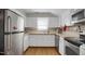 Kitchen with white cabinets, stainless steel appliances, and wood countertops at 312 Green St, Sanford, NC 27330