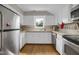 Kitchen featuring stainless steel appliances, white cabinetry, and tiled backsplash at 312 Green St, Sanford, NC 27330