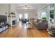 Inviting living room featuring hardwood floors, a white fireplace, and a comfortable seating area at 312 Green St, Sanford, NC 27330