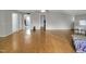 Open living room featuring hardwood floors, neutral paint and an open concept layout at 312 Green St, Sanford, NC 27330