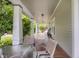 Relaxing porch with chairs, porch swing, and a view of the yard, perfect for outdoor living at 312 Green St, Sanford, NC 27330
