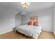 Bright bedroom features herringbone floors, gold chandelier, and eye-catching artwork at 320 W Martin St # 205, Raleigh, NC 27601