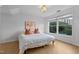 Bright bedroom features a large window with a view and herringbone wood flooring at 320 W Martin St # 205, Raleigh, NC 27601