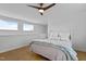 Bedroom features light-colored walls, herringbone floors, and natural light from two windows at 320 W Martin St # 205, Raleigh, NC 27601