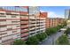 Parking Garage and apartment building featuring modern architecture with a mix of brick and glass facade at 320 W Martin St # 205, Raleigh, NC 27601