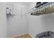 Walk-in closet with white wire shelving and a clothes rod for optimal storage at 320 W Martin St # 205, Raleigh, NC 27601