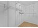 Walk-in closet with white wire shelving and wood flooring at 320 W Martin St # 205, Raleigh, NC 27601